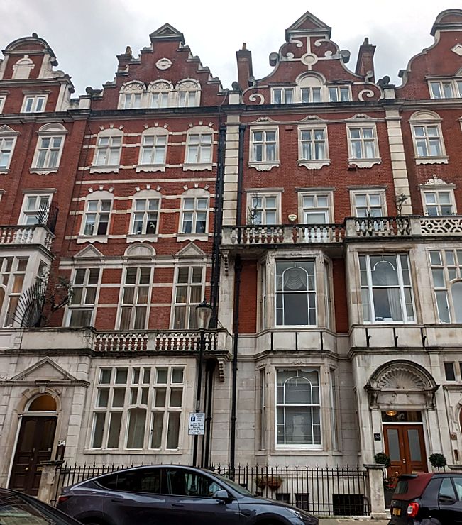 Red-brick mansion block elevation at Cadogan Square, Knightsbridge, London