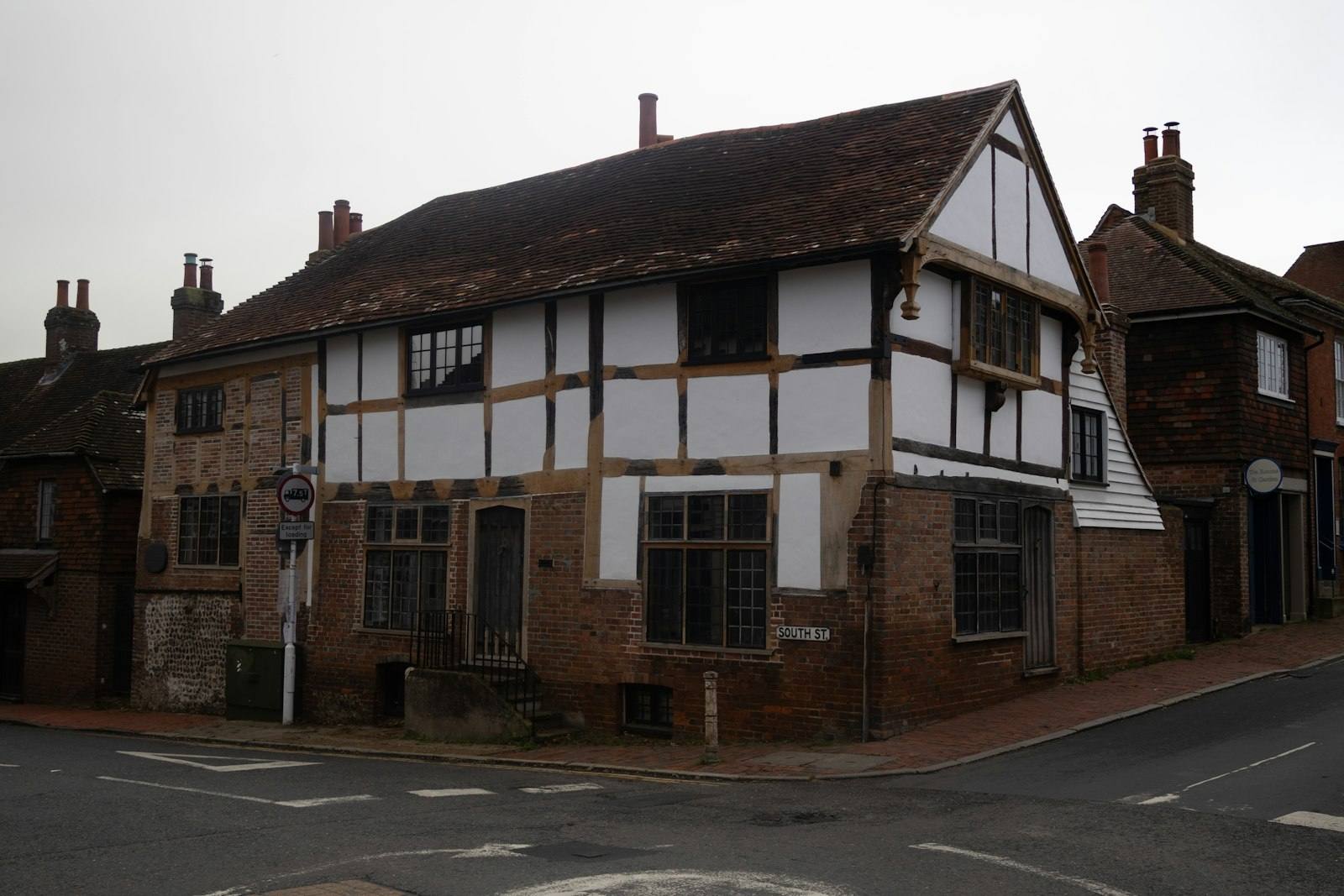 A timber-framed building with brick infill on a street corner