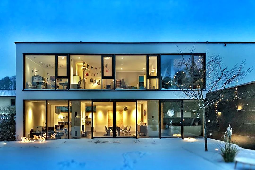 A contemporary detached home at dusk — the kind of residential property suited to a Level 3 Building Survey